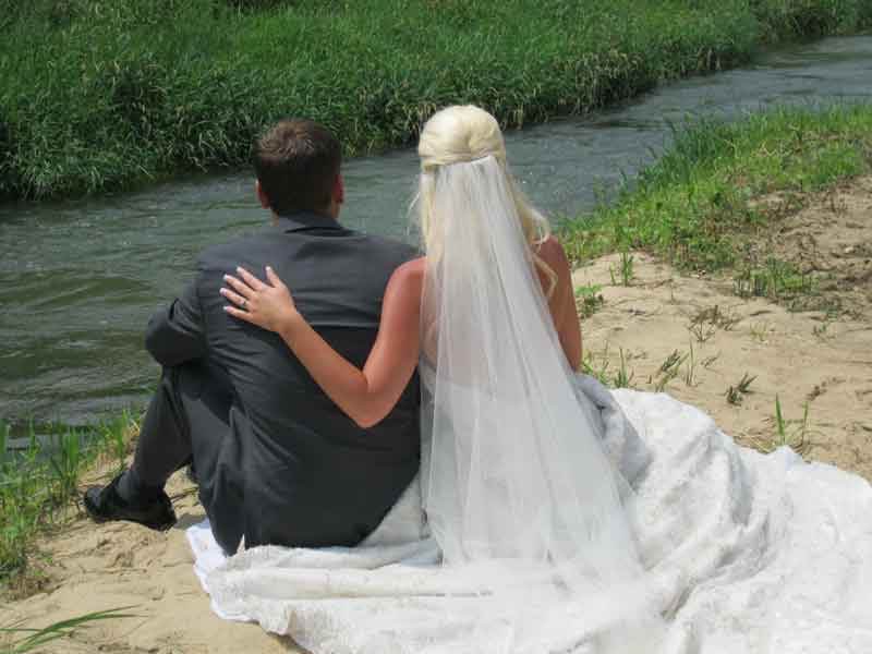 nature loving bride and groom along Winnebago Creek